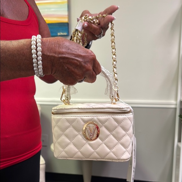 Valentino Orlandi Handbags - Valentino Orlandi Cream and Gold Mini Bag with Quilted Design
$99.00 TODAY ONLY